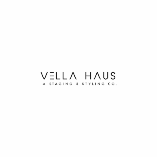 the letter v followed by three horizontal lines followed by "lla," a space, then h followed by an upside-down "v" followed by "us."  beneath that is "a staging & styling co."