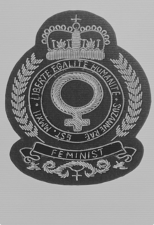 feminist crest with the words liberte, egalite, humanite, suzanne rae