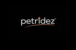 petridez with a animal paw that is pink on the i in the word ridez with a pink line under the name